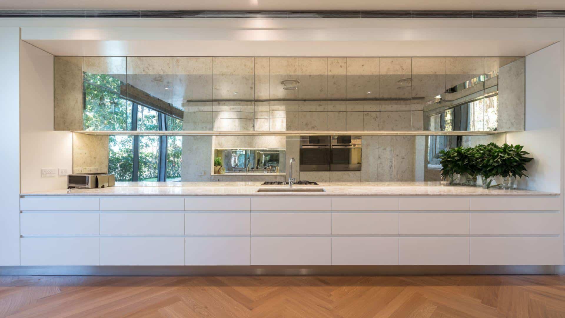 Minimalist Kitchen with Mirrored Backsplash