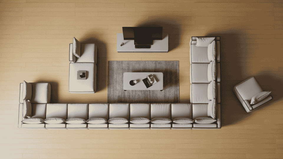 a top-down view of a spacious living room featuring a large sectional sofa, tv stand, coffee table, and armchair