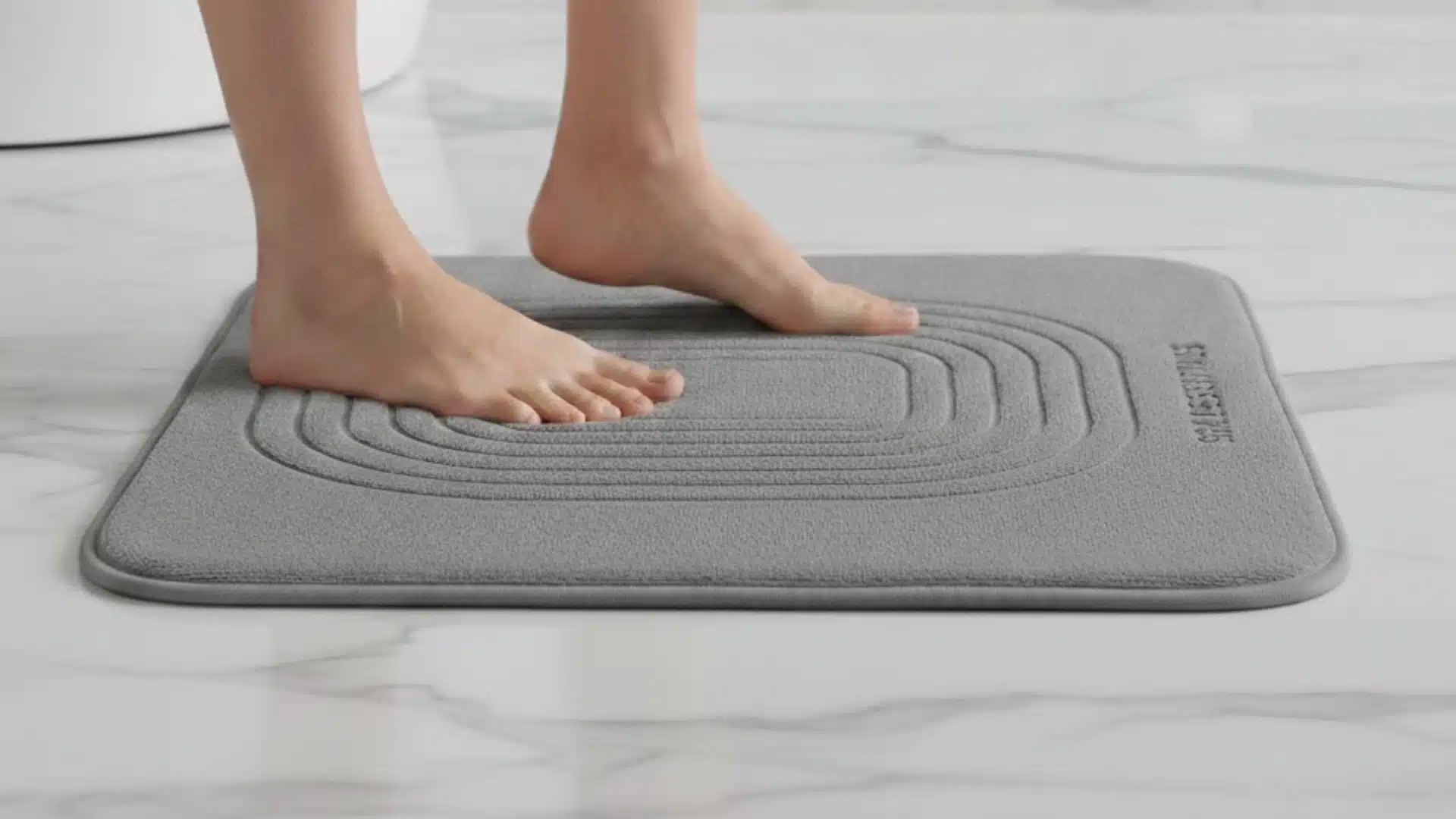rockport gray exterior house with white trim, stone entry, and wood front door in natural daylight (2)