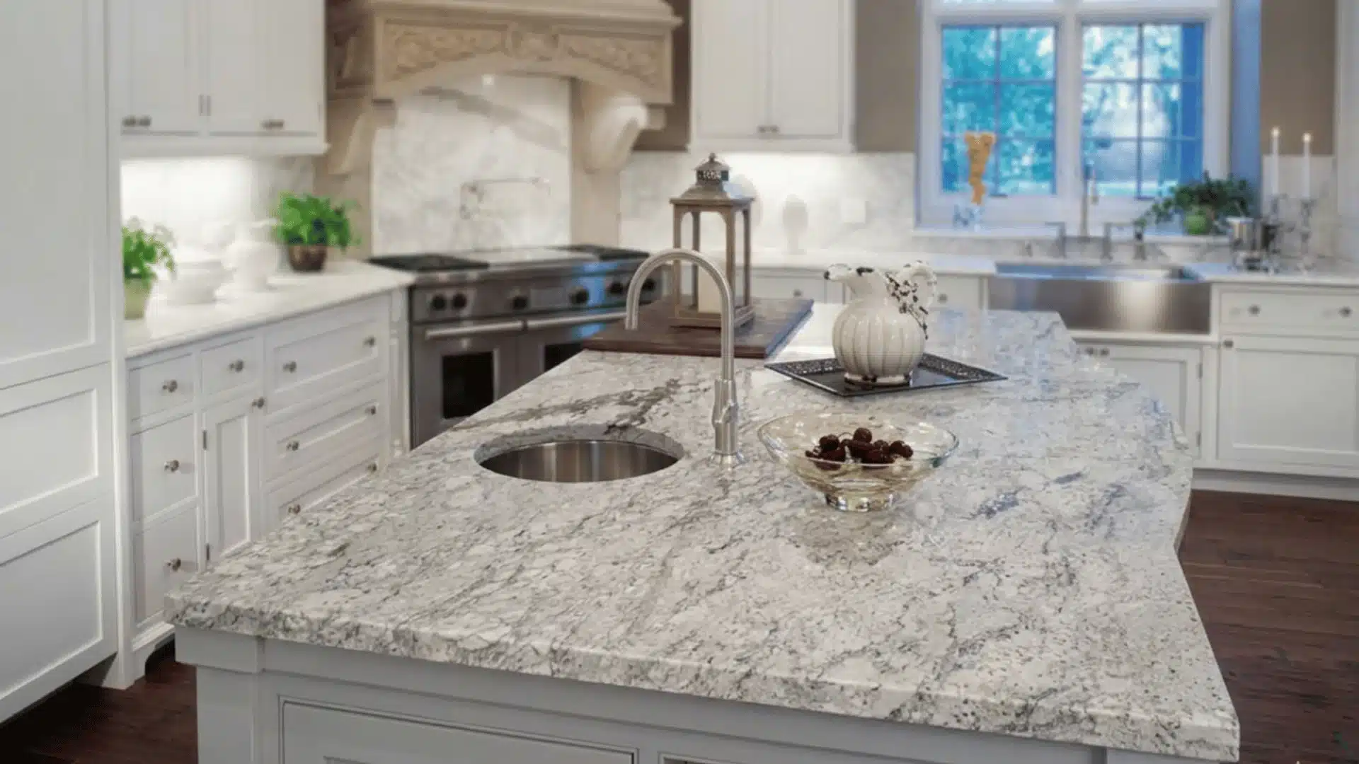 a countertop picture of new river white with number of kitchen stuff on it as fruits planters and other basic stuff