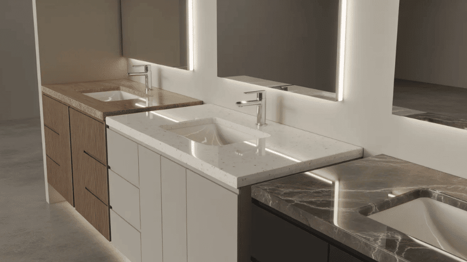 comparison of laminate quartz and marble bathroom vanity countertop materials in a modern showroom setting
