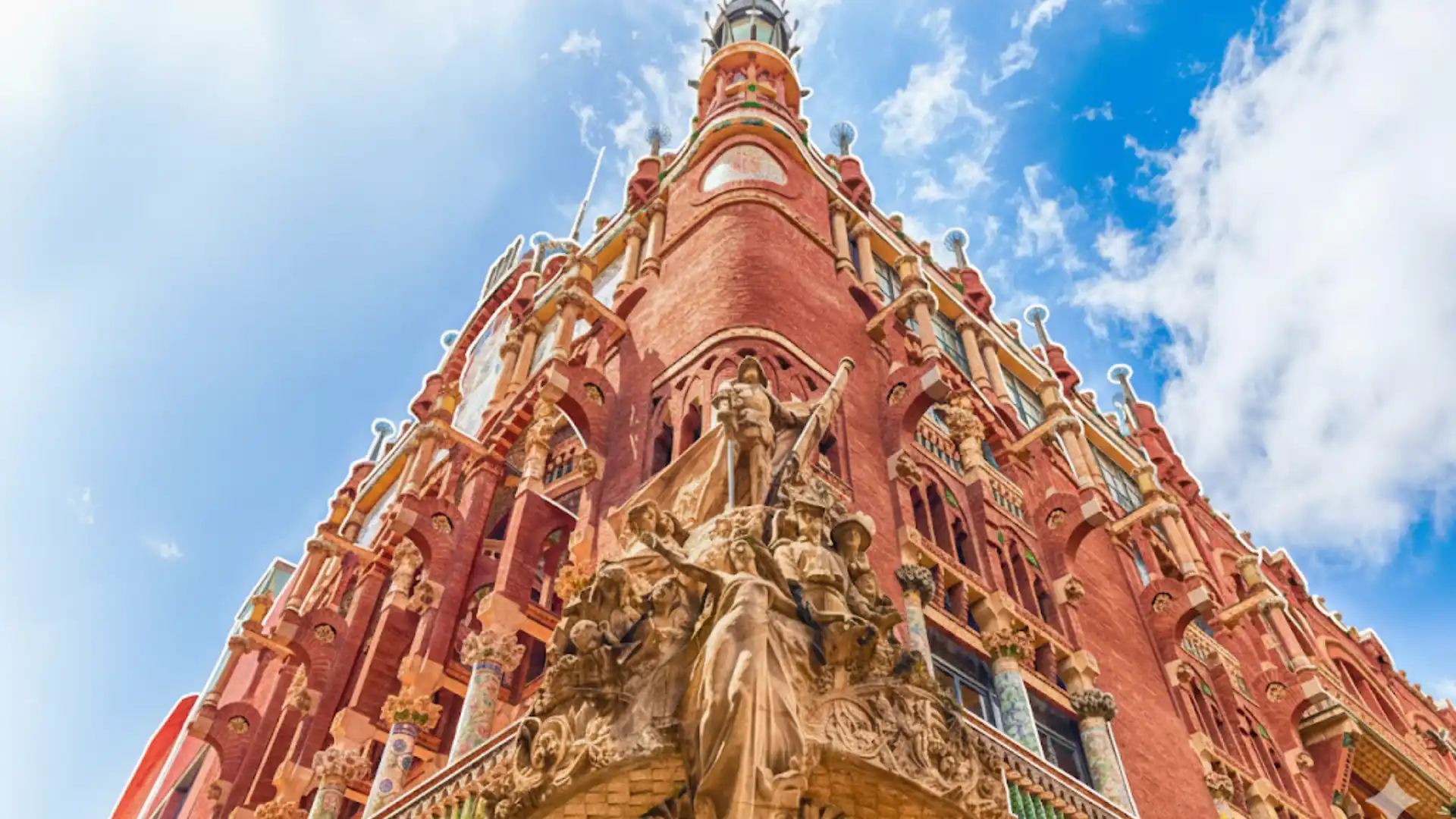 palau de la música catalana barcelona spain shows red brick arches and pillars covered in colorful mosaic patterns