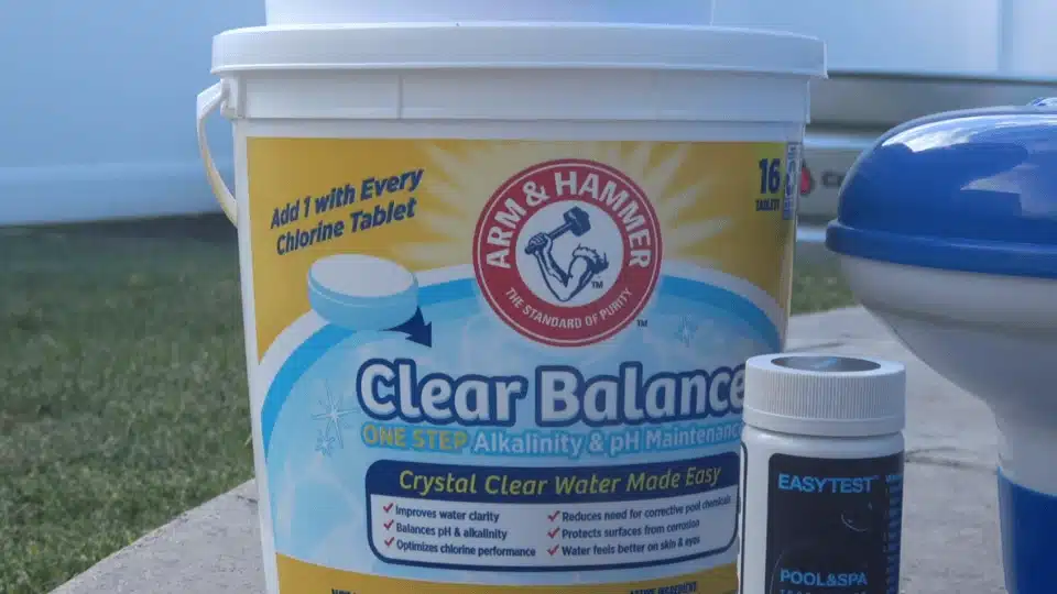 pool chemical supplies including ph balancer bucket, test strips, and a floating chlorine dispenser