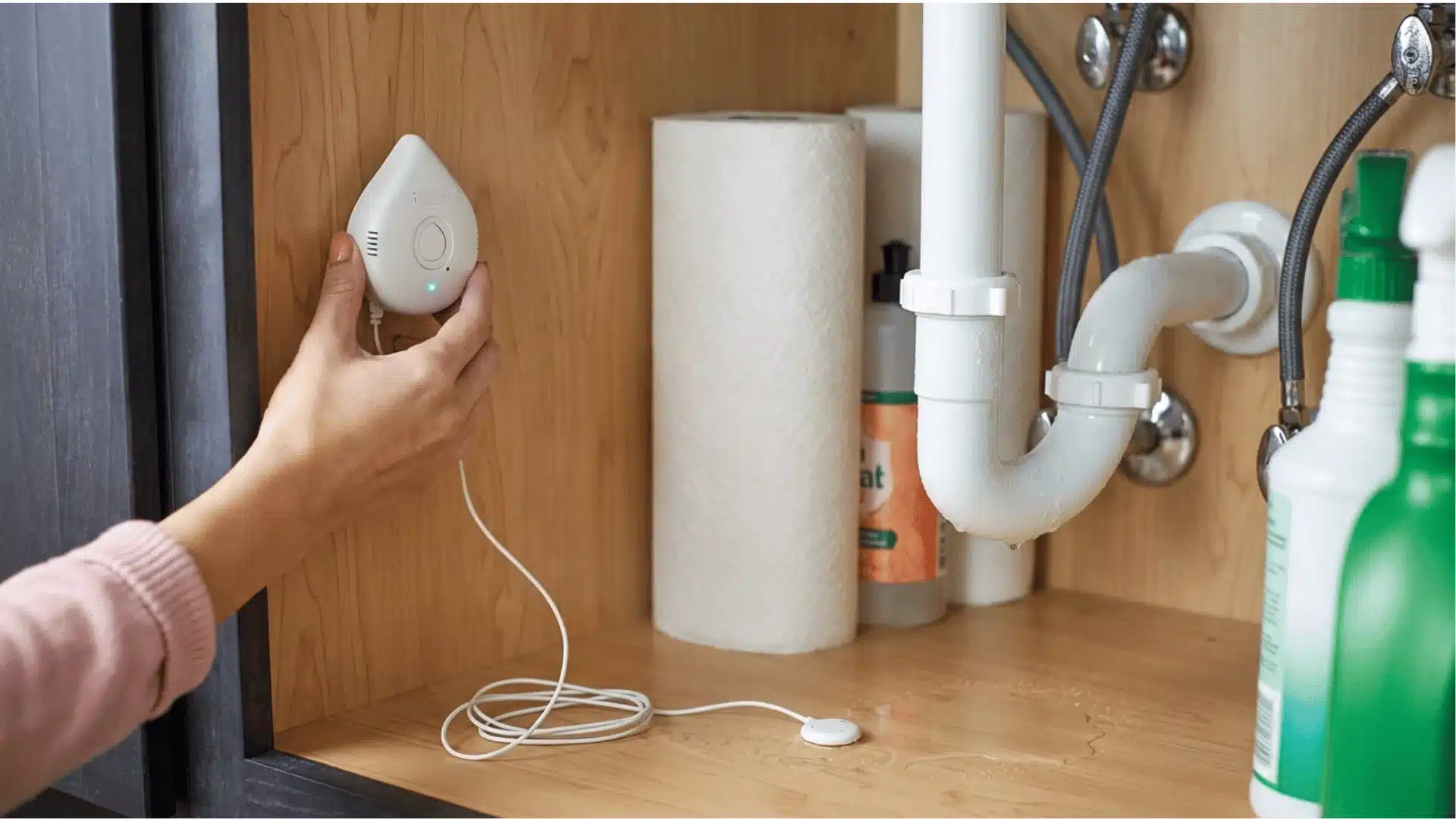 the image depcits a residential under-sink plumbing setup featuring