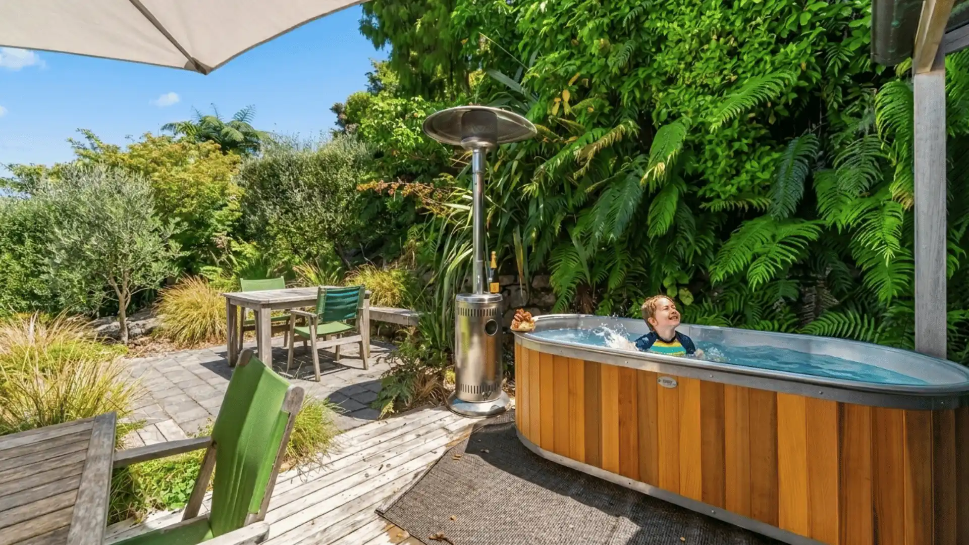 hot tub made from natural wood barrel staves, positioned on a wooden deck shape