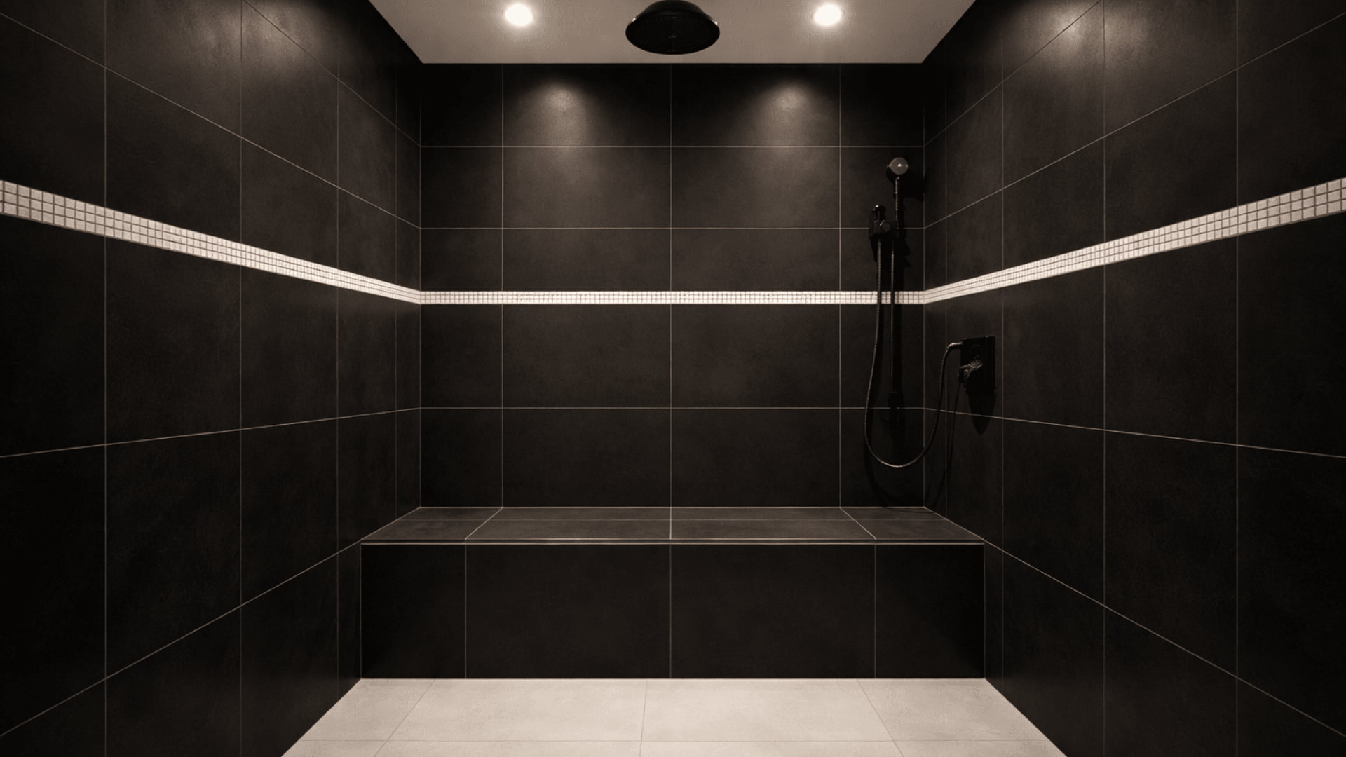 matte black tiled wet room with white mosaic border, built in bench and black rainfall showerhead