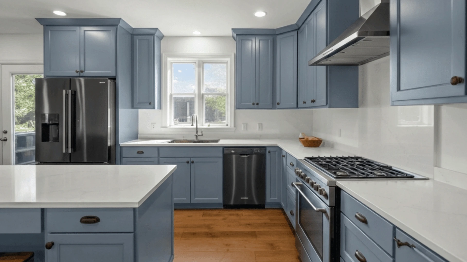 modern kitchen interior with dark navy blue shaker-style cabinets and white quartz countertops (1) (1)