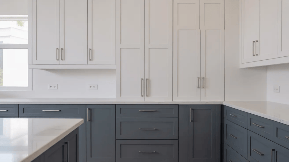 timeless kitchen cabinet colors with white upper cabinets and charcoal lower cabinets in bright kitchen