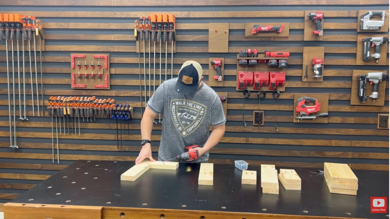diy outdoor furniture materials being cut and prepared on a workshop table for a patio chair and table set