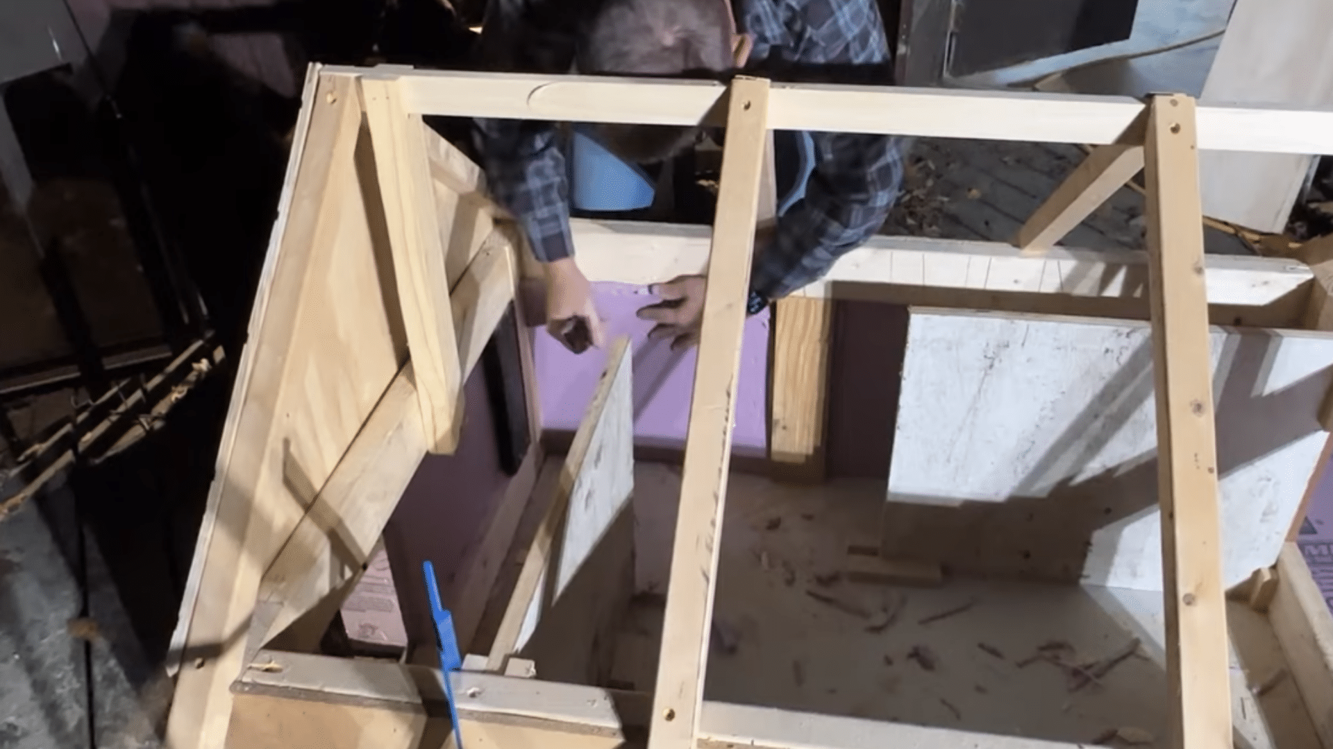 cozy inside of an outdoor cat shelter with soft bedding and space for cats to curl up and feel safe