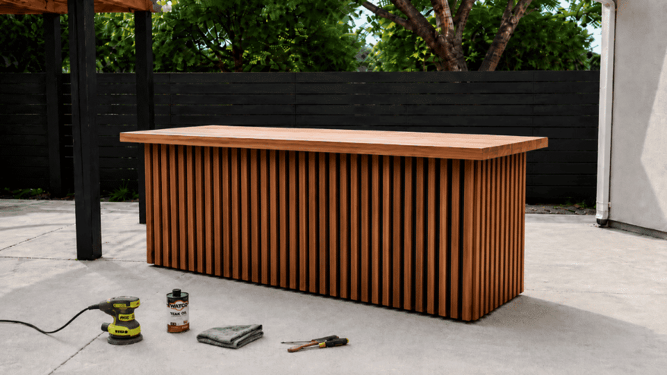 diy outdoor bar with thick countertop installed on slatted base