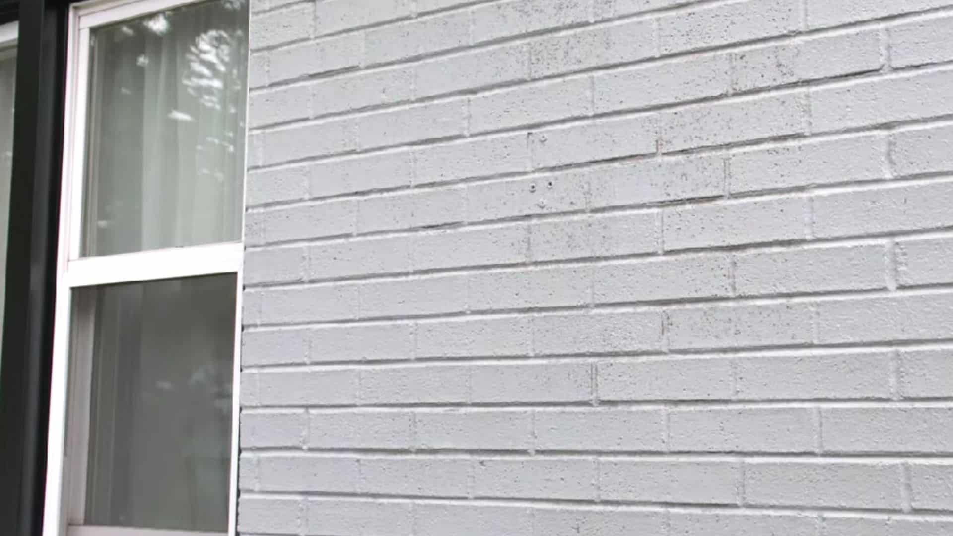 finished painted brick house exterior with clean and fresh look after painting