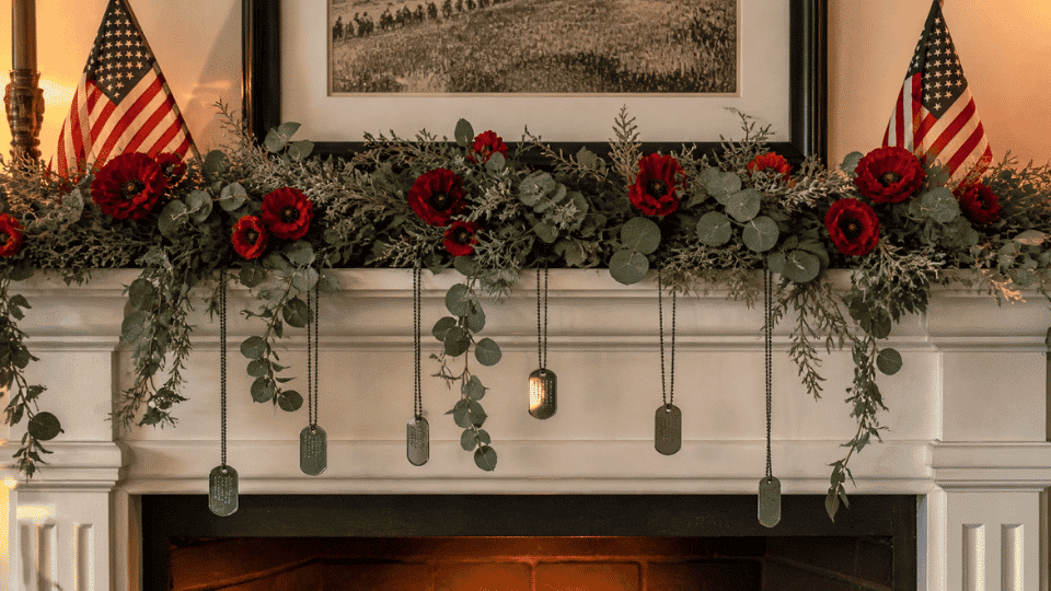 fireplace mantle with eucalyptus garland red poppies and hanging dog tags