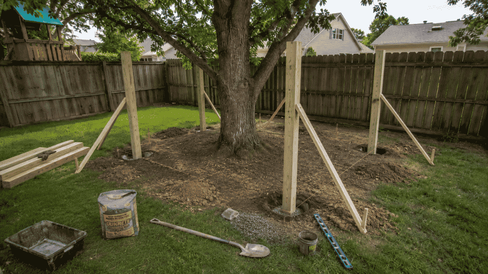 four 6x6 posts set in the ground for a simple kids treehouse platform