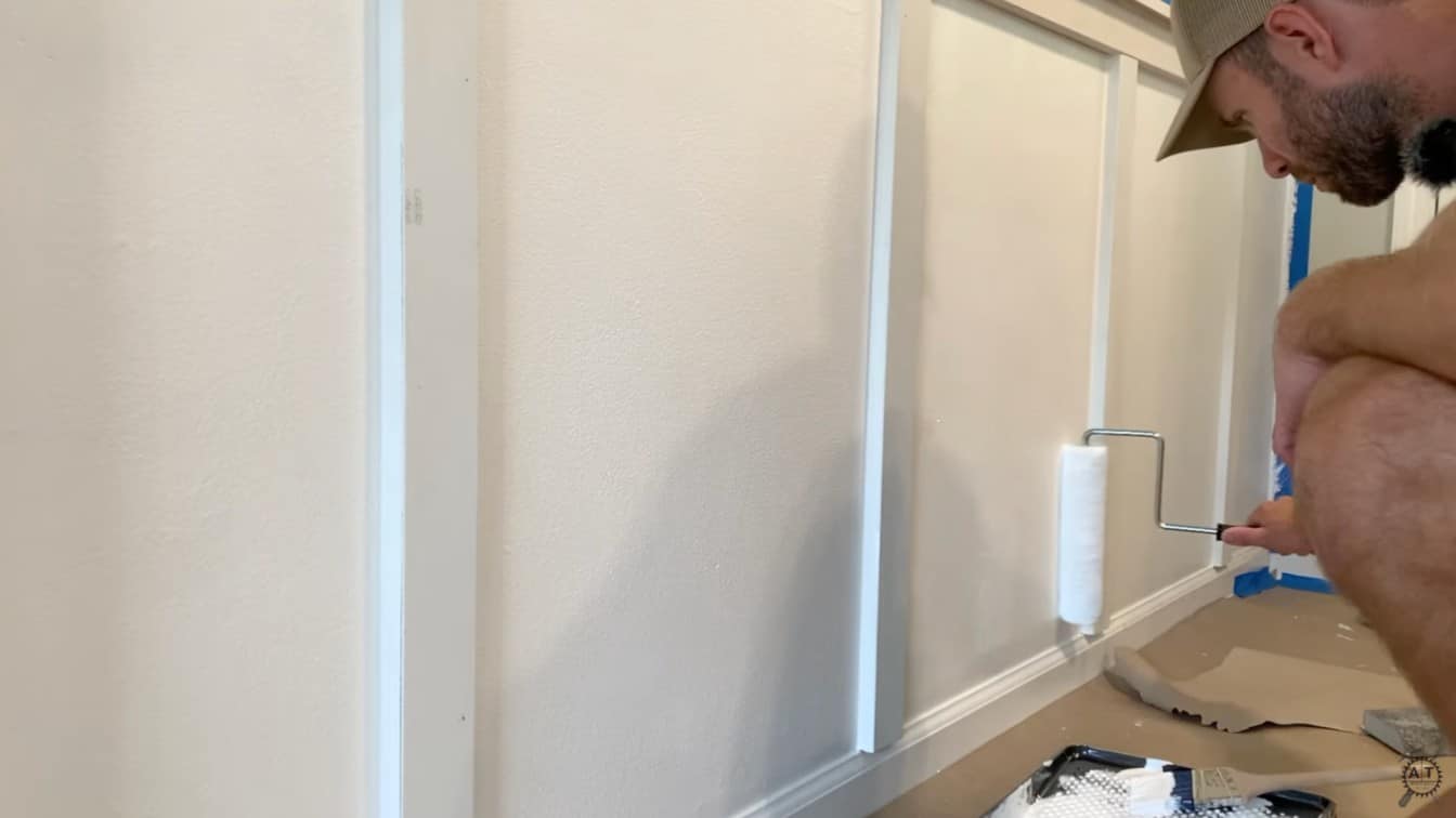 paint being rolled between the trim boards