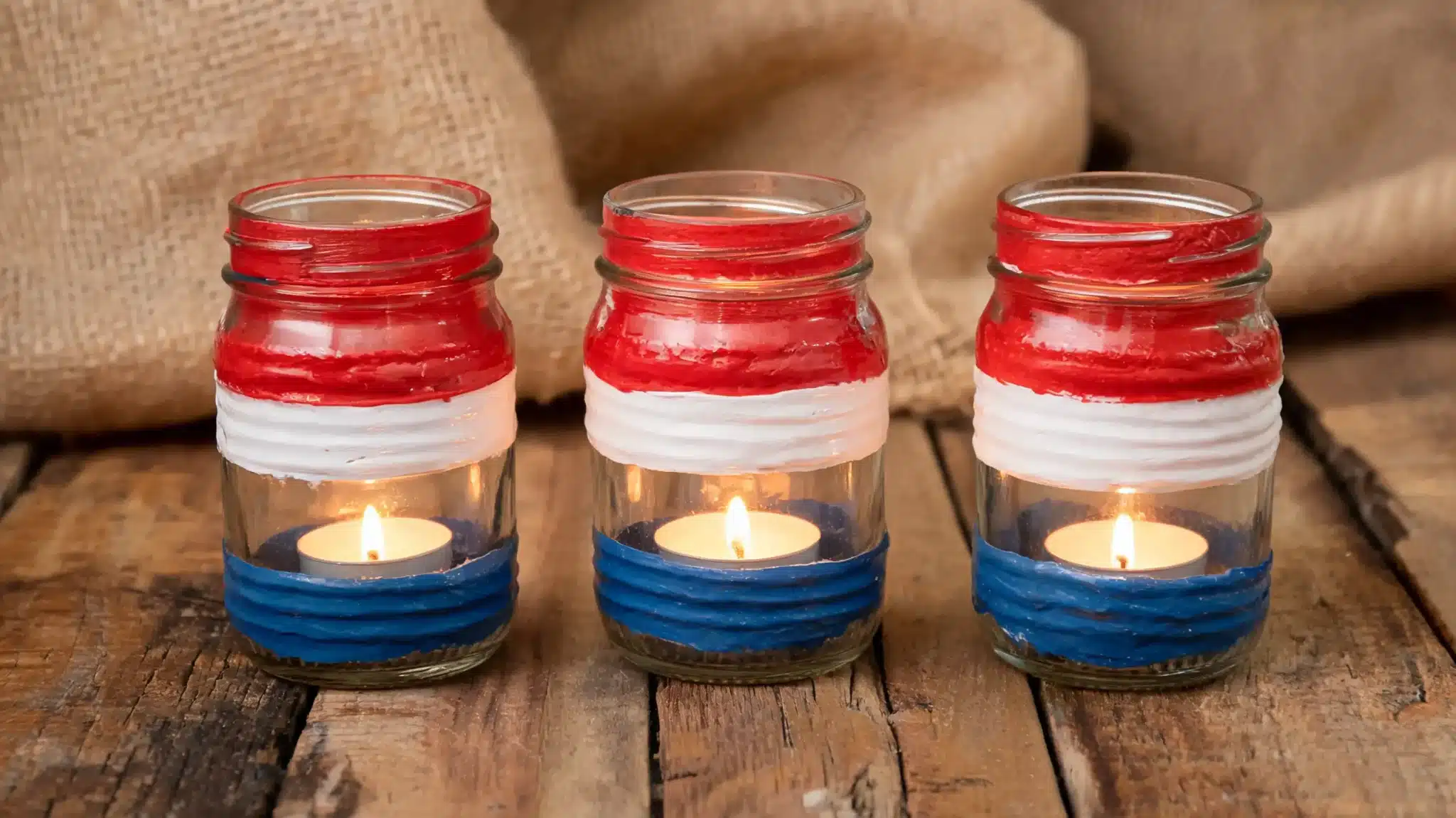 painted mason jars with glowing candles