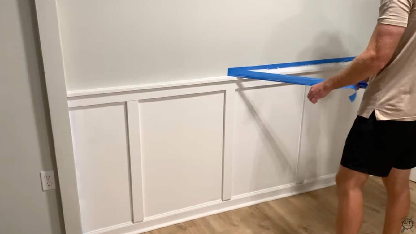 painter tape being removed from the finished wall
