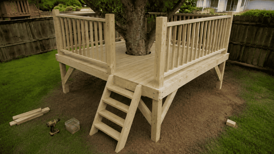 railings and angled ladder added to a low kids treehouse platform