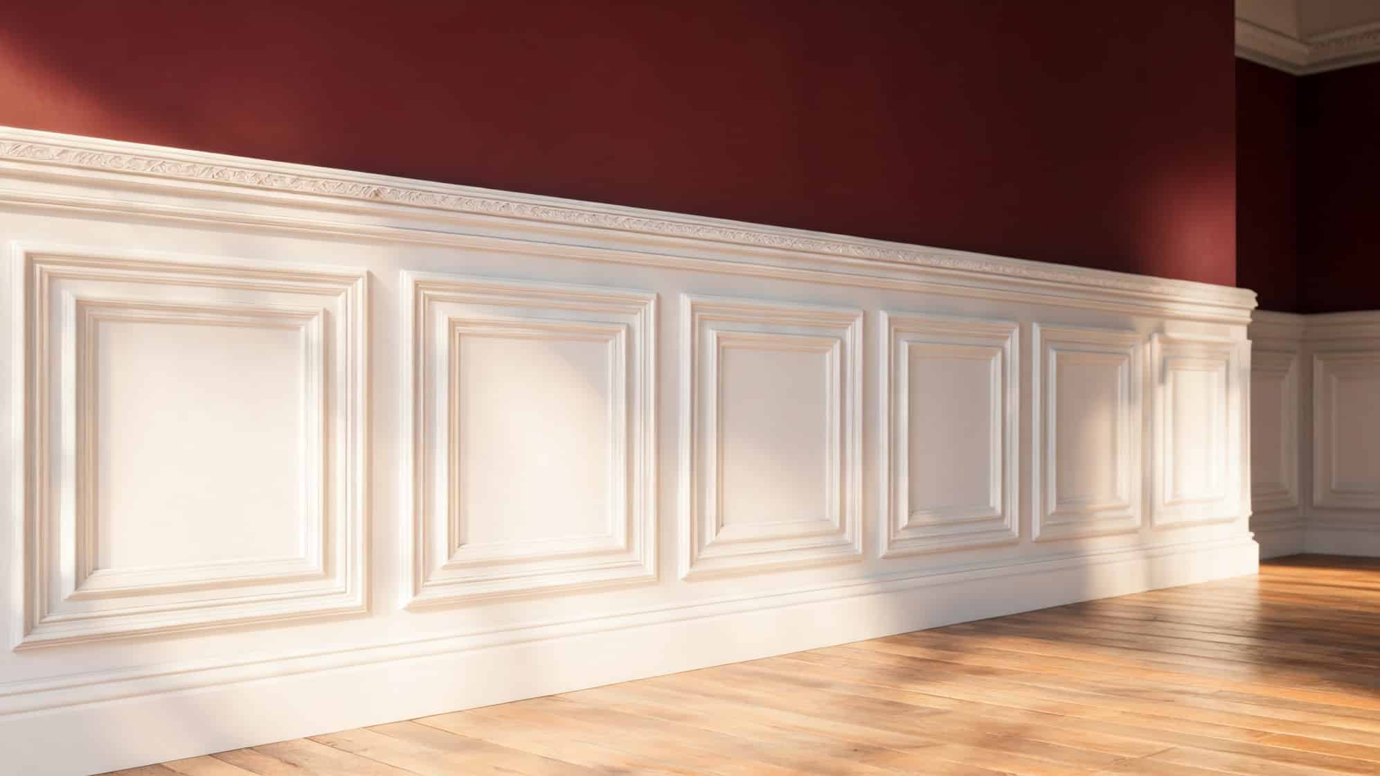 room interior featuring white wainscoting against rich red walls sunlight casts gentle shadows on the polished wooden floor