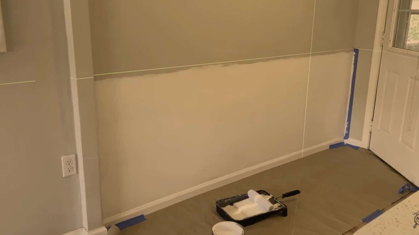 wall prepped with tape paint and tools ready for install