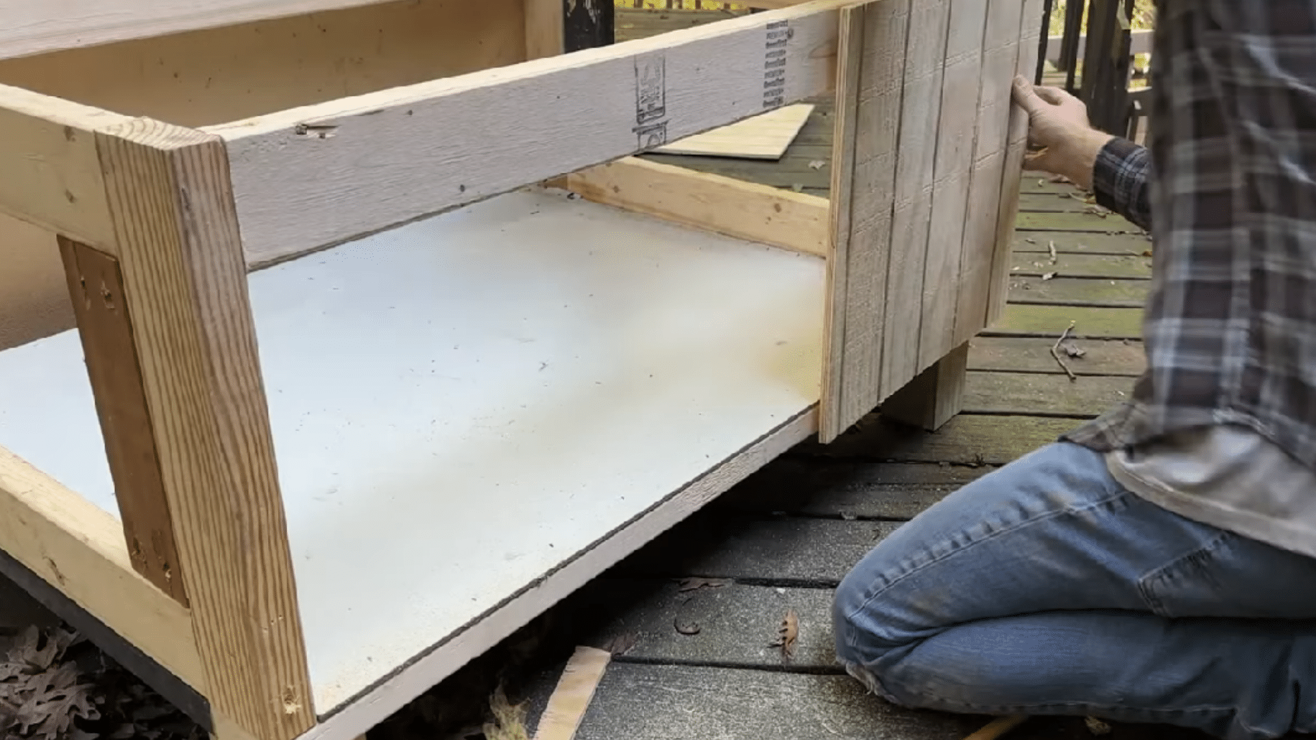 wooden cat shelter frame with two door openings, giving outdoor cats an easy entrance and escape route