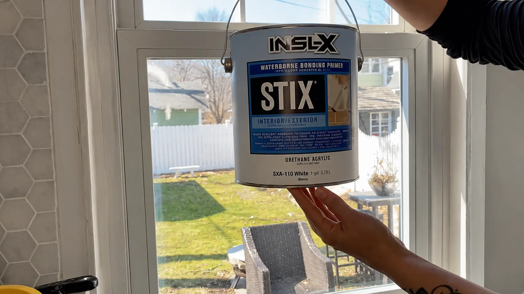 bonding primer applied to a glossy vinyl window frame before painting