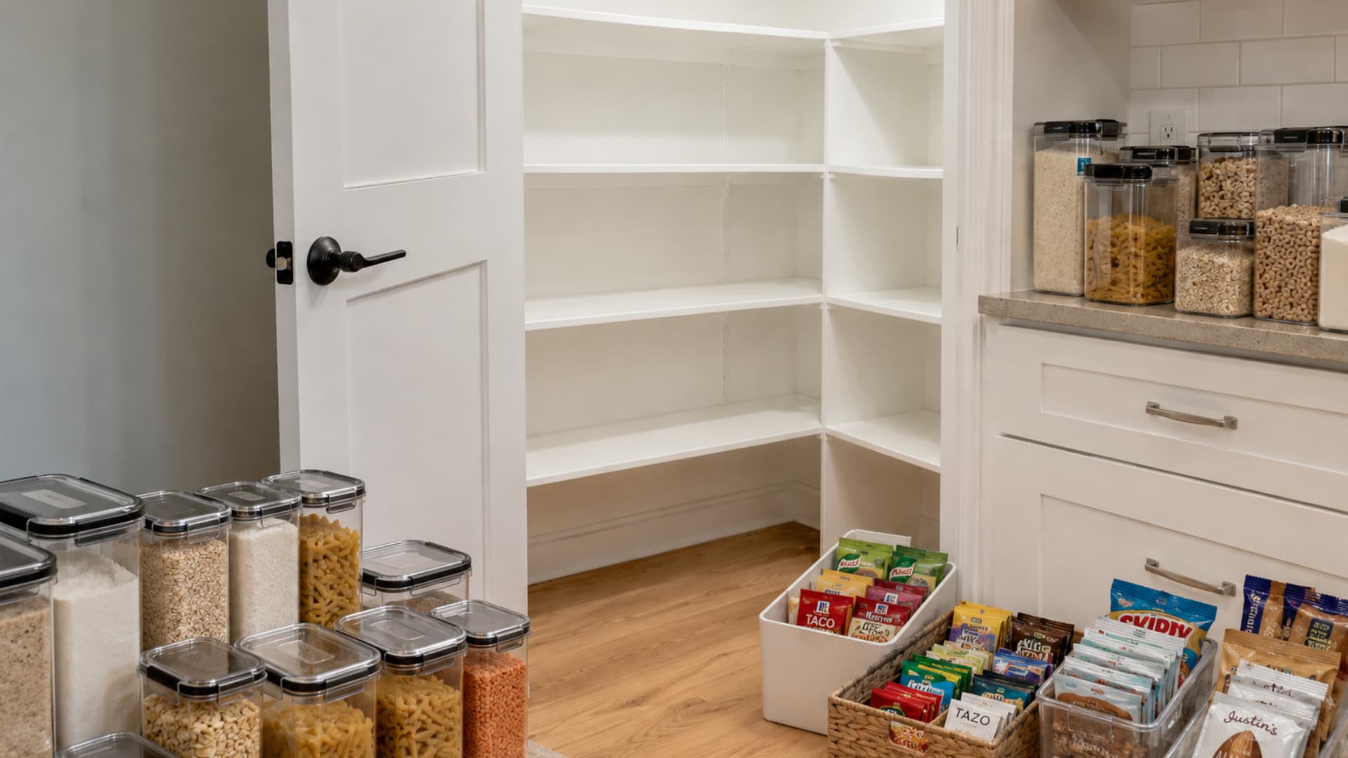 clear airtight containers filled with dry goods and storage bins prepared for small pantry items and snacks organizing