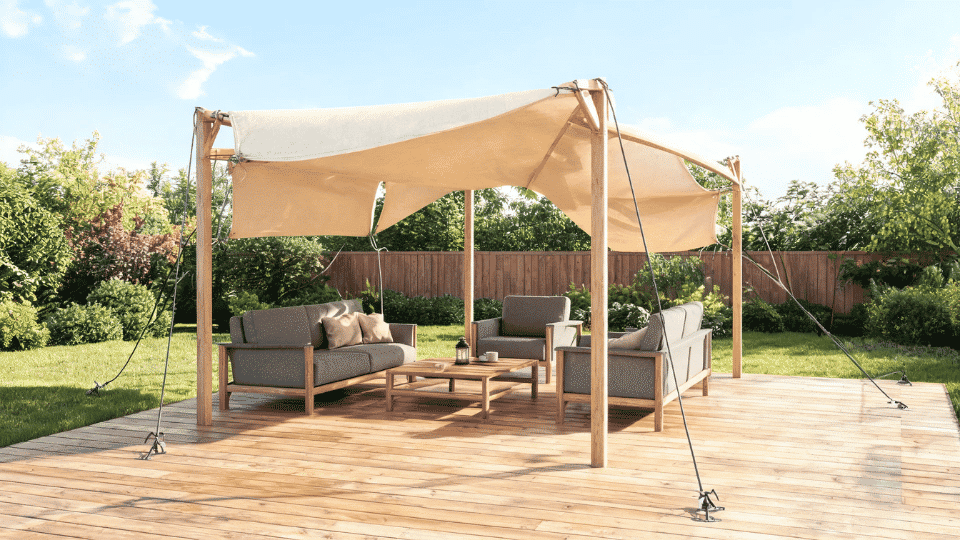 covered deck ideas on a budget with a canvas canopy shading a casual seating area on a wood deck
