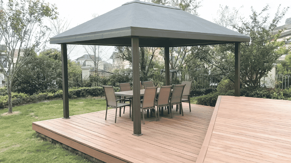 covered deck ideas on a budget with dining chairs softly shaded in a hardtop gazebo beside a deck