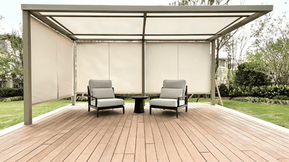 covered deck ideas on a budget with roller shades softly shading lounge chairs on a wood deck corner