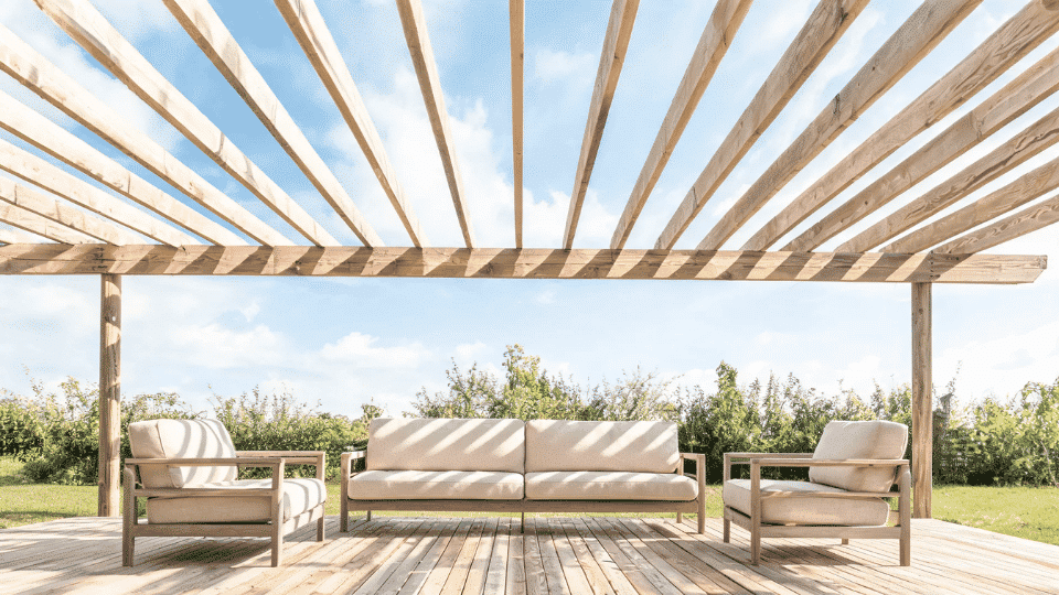 covered deck ideas on a budget with seating softly shaded under a rustic rafter-only cover