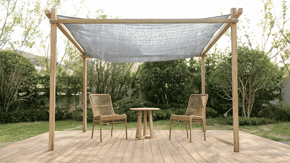 covered deck ideas on a budget with shade cloth softly shading chairs under a simple wood frame