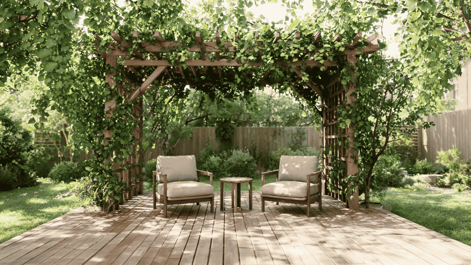 covered deck ideas on a budget with chairs in soft shade under a vine-covered pergola