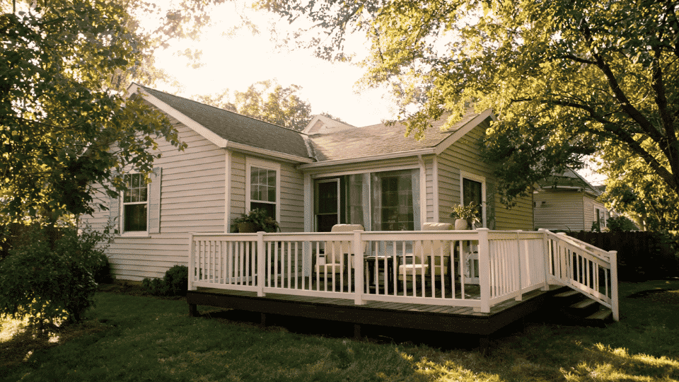 deck color ideas with espresso brown boards and cream railings on a shaded beige home deck