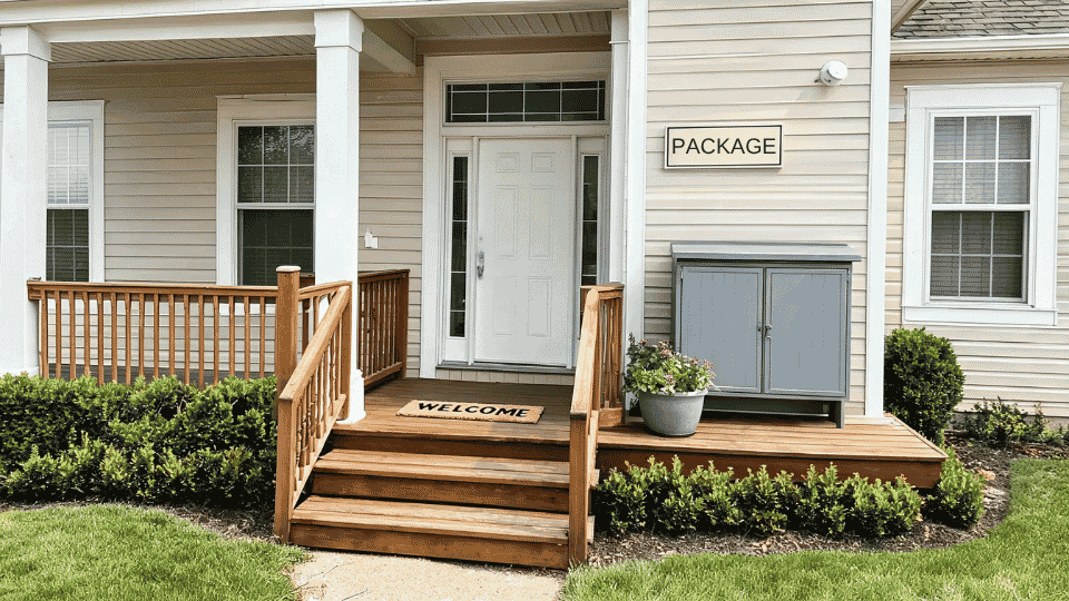 front porch decorating ideas with delivery cabinet, house numbers, planter, and entry light