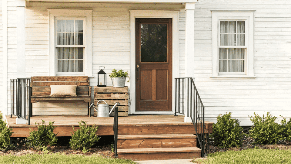 front porch decorating ideas with reclaimed bench, vintage crate, planter, and rustic decor