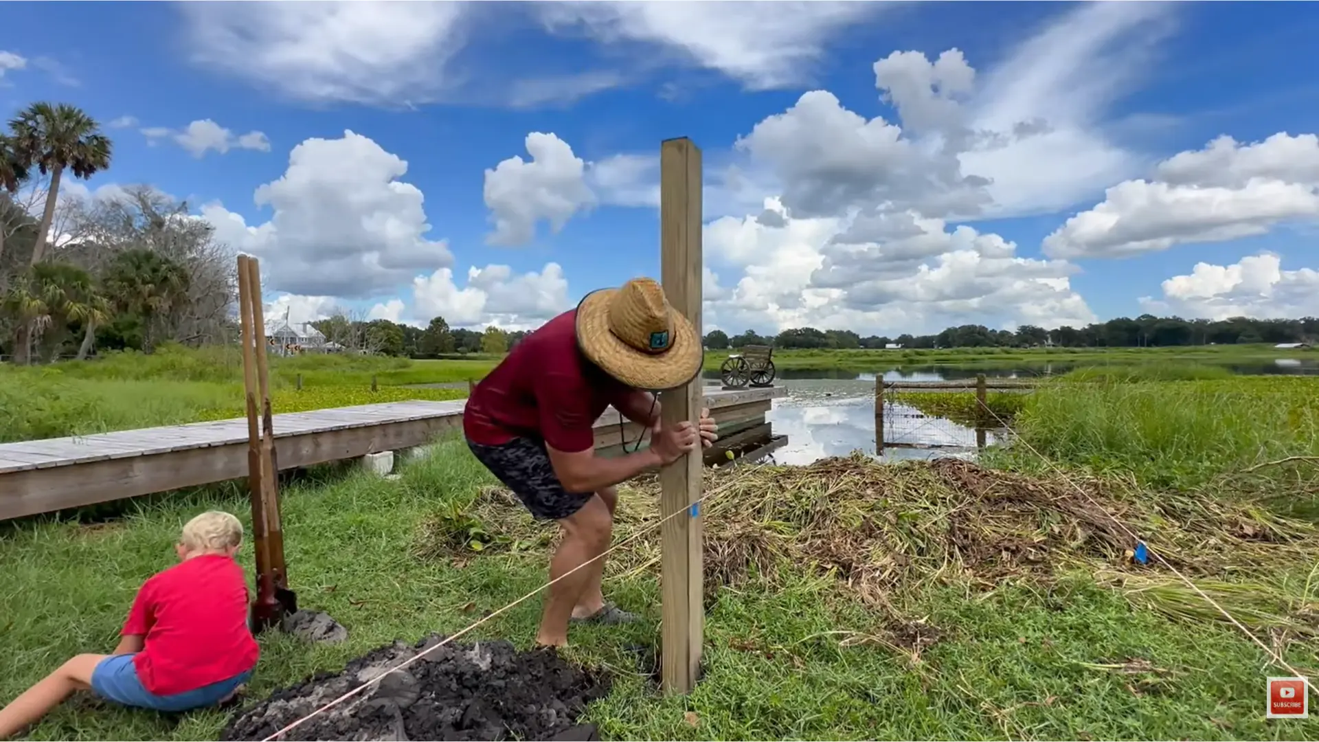 straight dock posts aligned with string lines during a how to build a dock project