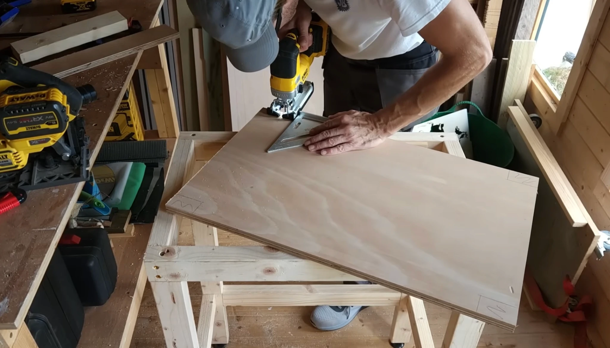 installing a wooden base shelf on diy router table frame for storage and support