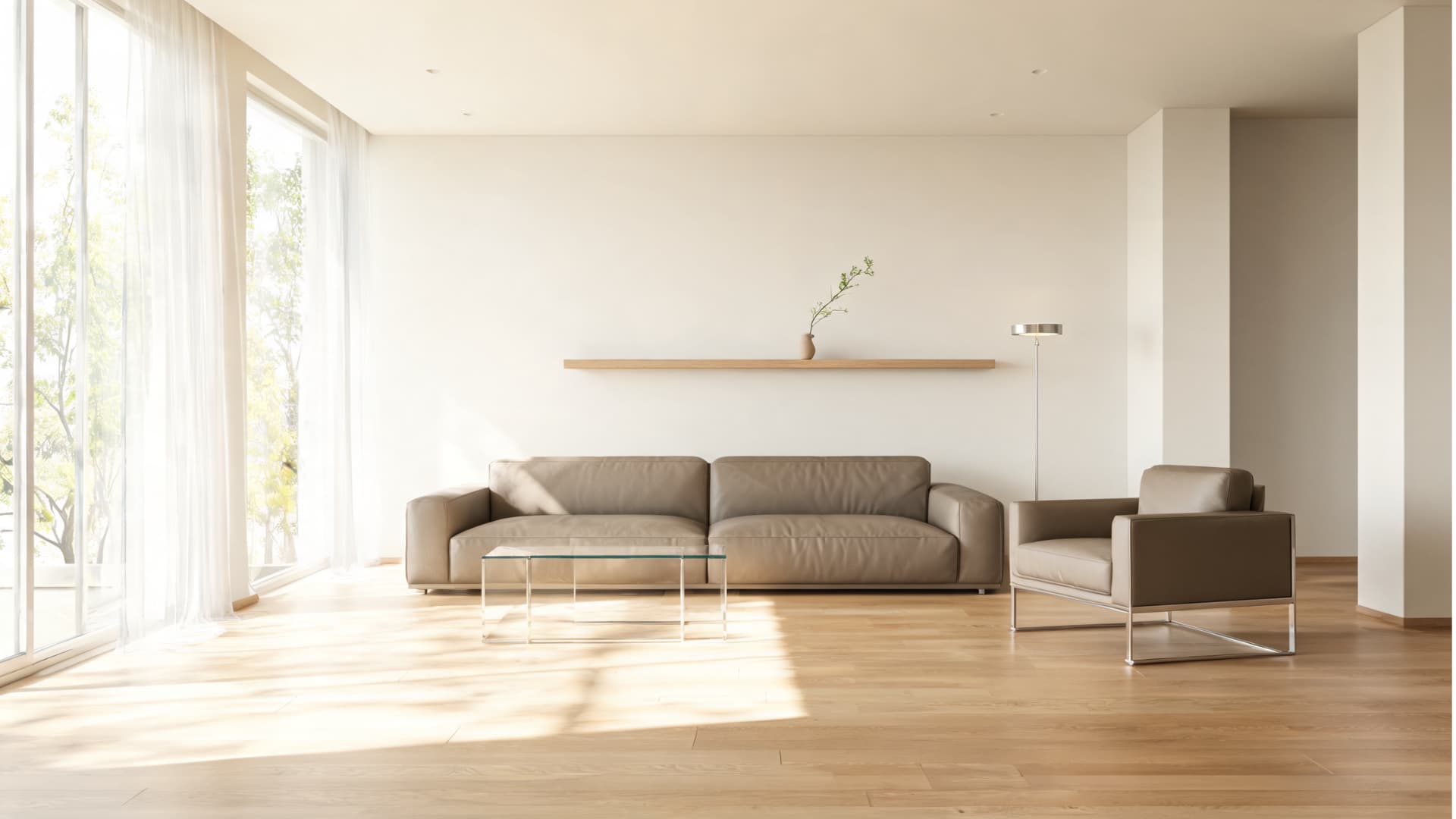 minimal modern living room with neutral sofa, glass table, wood floors, soft light, and clean open space