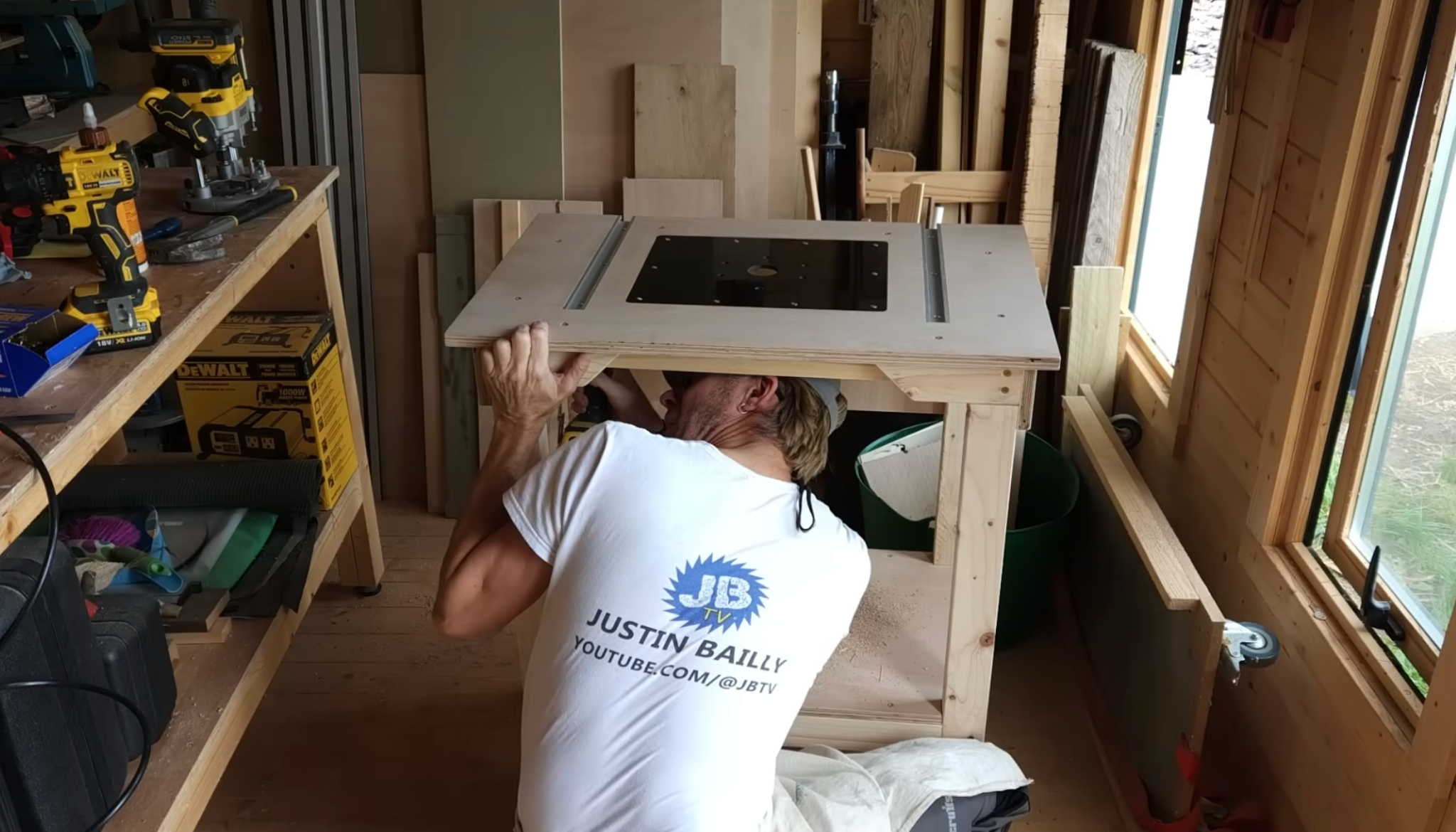 person attaching router table top to wooden frame ensuring alignment stability and flat surface for woodworking tasks