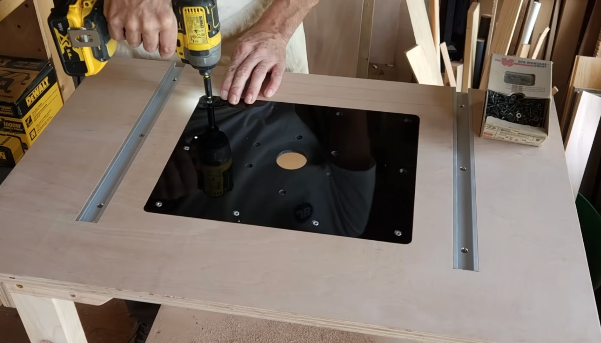 person securing router base plate into tabletop cutout using screws for stable router table setup