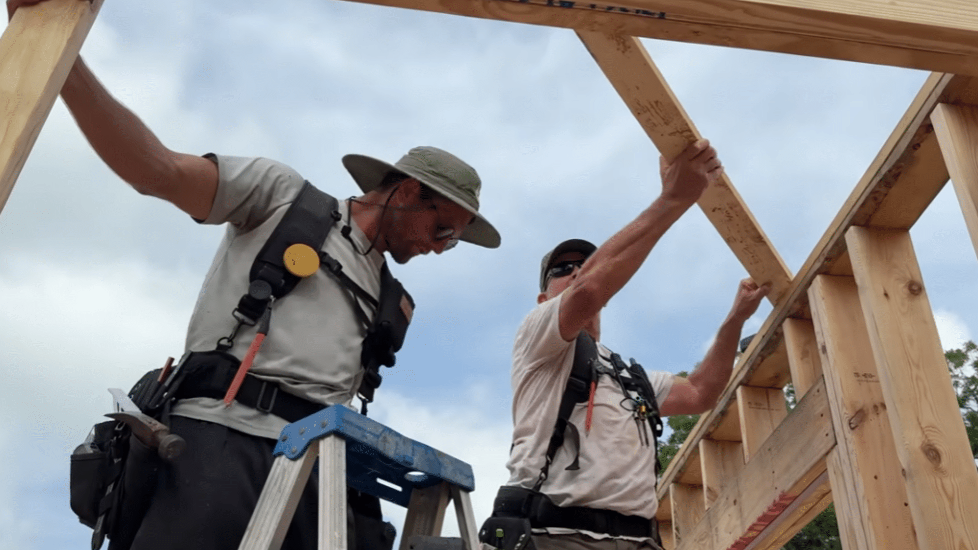 porch frame with temporary braces and measurements used to square beam alignment