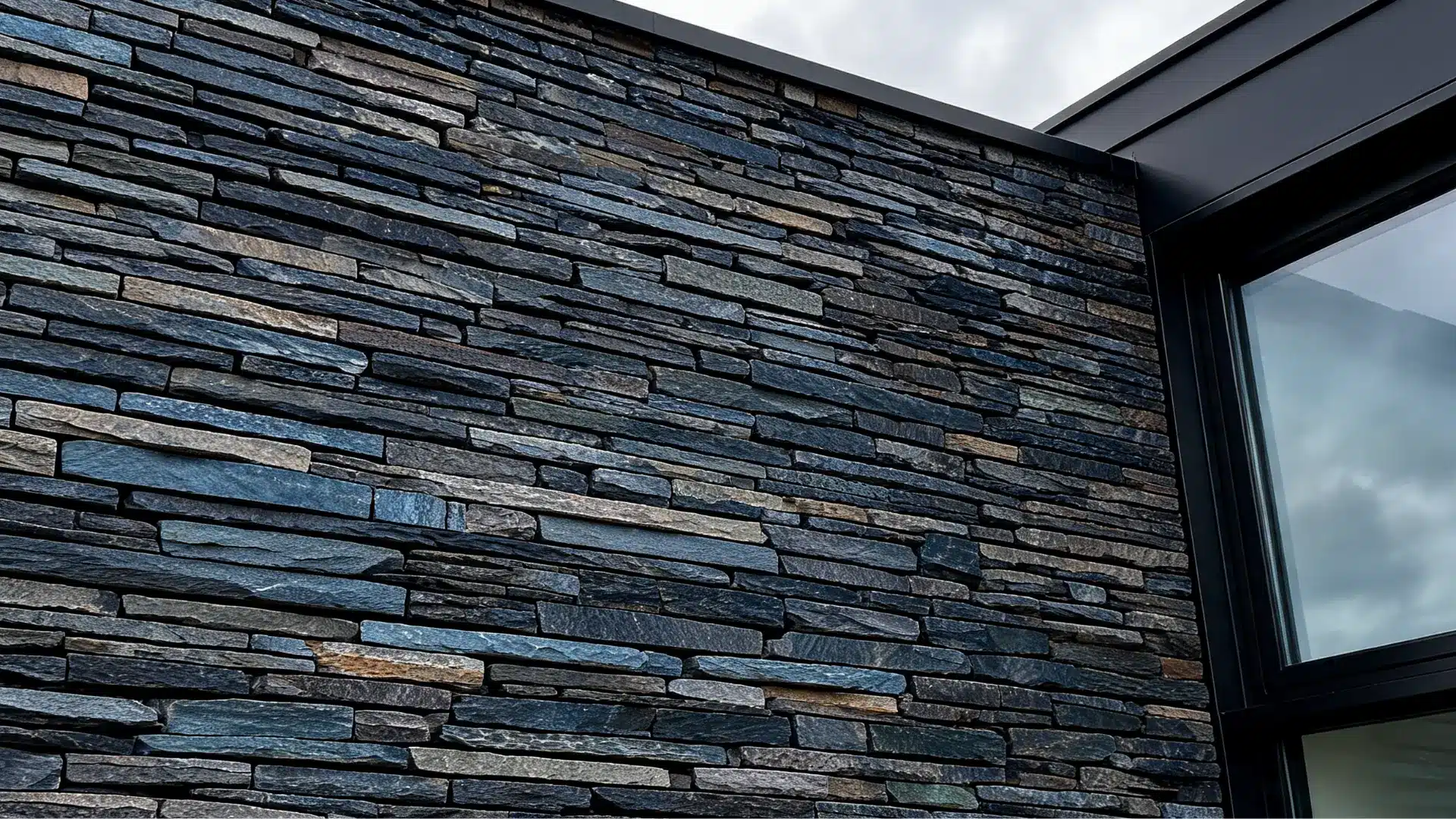 dark slate stone cladding on a modern house accent wall