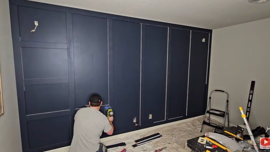 board and batten diy wall with horizontal battens added to create a clean grid pattern across the wall