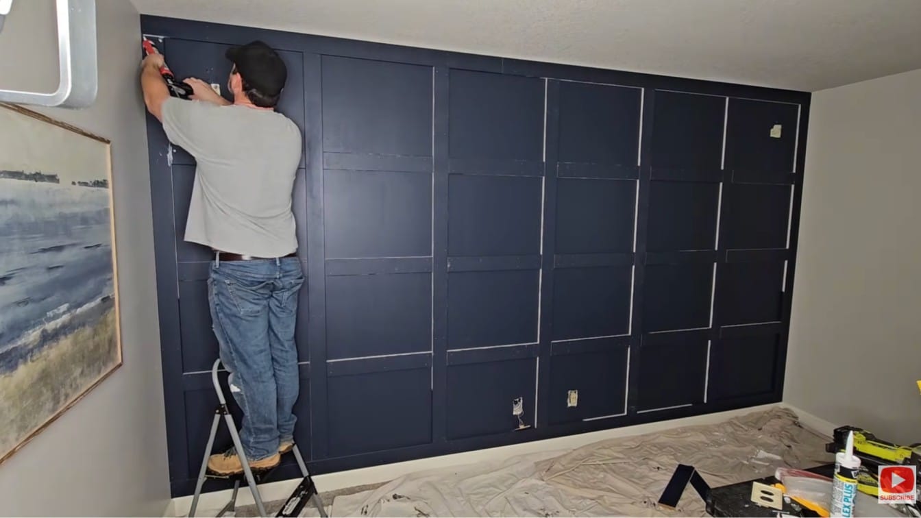 board and batten diy wall with horizontal battens added to create a clean grid pattern across the wall