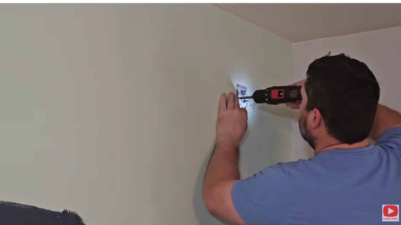board and batten diy prep showing outlet cover removed before painting and trim install on bedroom wall