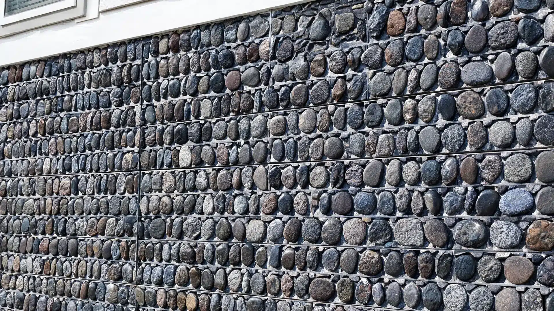 river rock exterior house wall with smooth rounded stones natural decorative texture