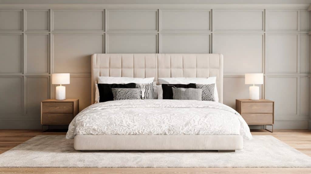 soft greige grid board and batten bedroom wall with beige bed wood nightstands white bedding and lamps