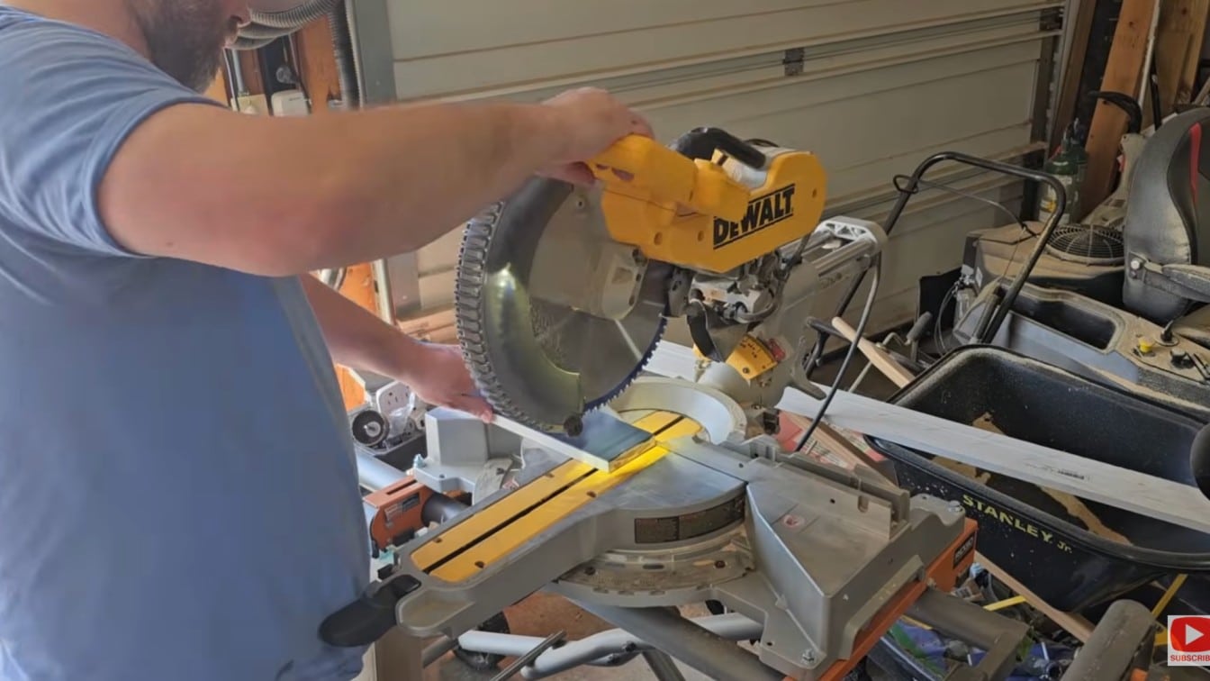 board and batten diy trim boards being cut with a miter saw before wall installation in a home workspace