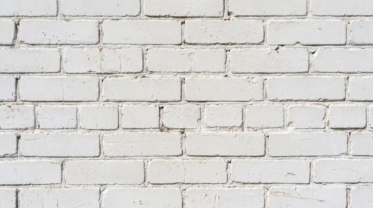 Crisp white brick stain brightens a textured brick wall while preserving its natural character.